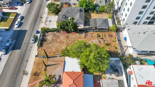 an aerial view of residential house with outdoor space and swimming pool