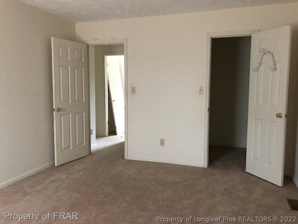 6548 Applewhite Road Fayetteville, NC 28304 - Photo 8 of 10 an empty room with windows
