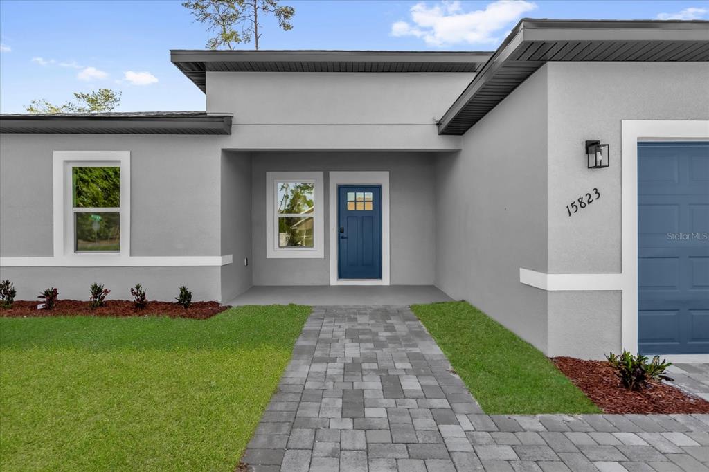 15823 Southwest 27th Ave Road Ocala, FL 34473 - Photo 1 of 1 a front view of a house with a garden