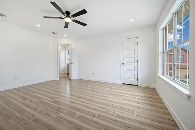 a bathroom with a sink a toilet a shower and a mirror