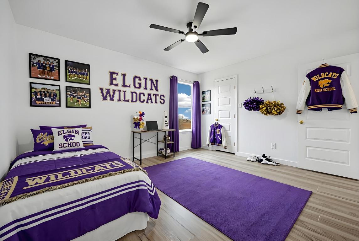 13501 Sierra Wind Lane Elgin, TX 78621 - Photo 26 of 31 Bedroom featuring wood finished floors and a ceiling fan