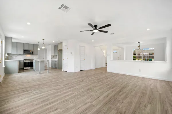 a living room with furniture potted plant and window