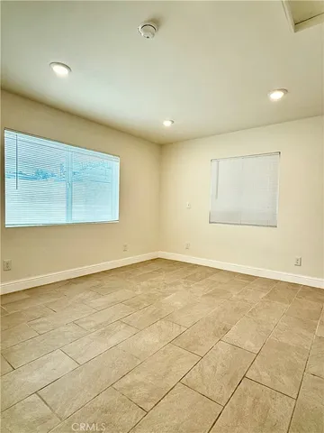 an empty room with a empty space and a window