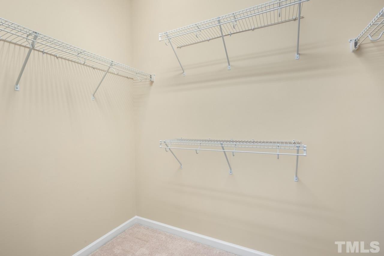 2433 Pilsley Road Apex, NC 27539 - Photo 18 of 28 a view of a room with racks on the wall