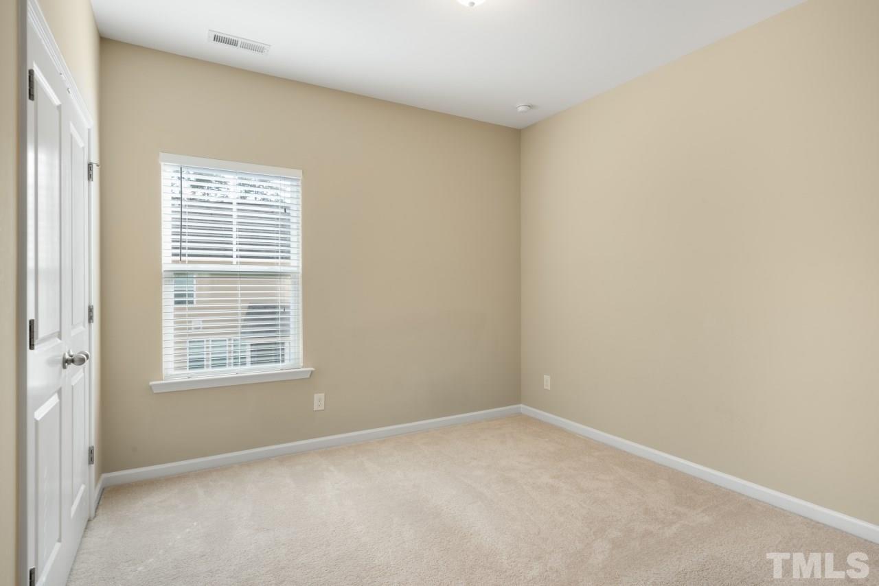 2433 Pilsley Road Apex, NC 27539 - Photo 22 of 28 a view of an empty room with a window