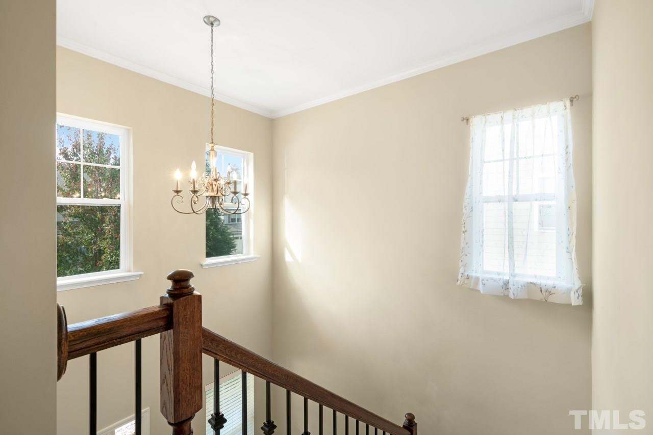 2433 Pilsley Road Apex, NC 27539 - Photo 24 of 28 a view of a hallway with windows