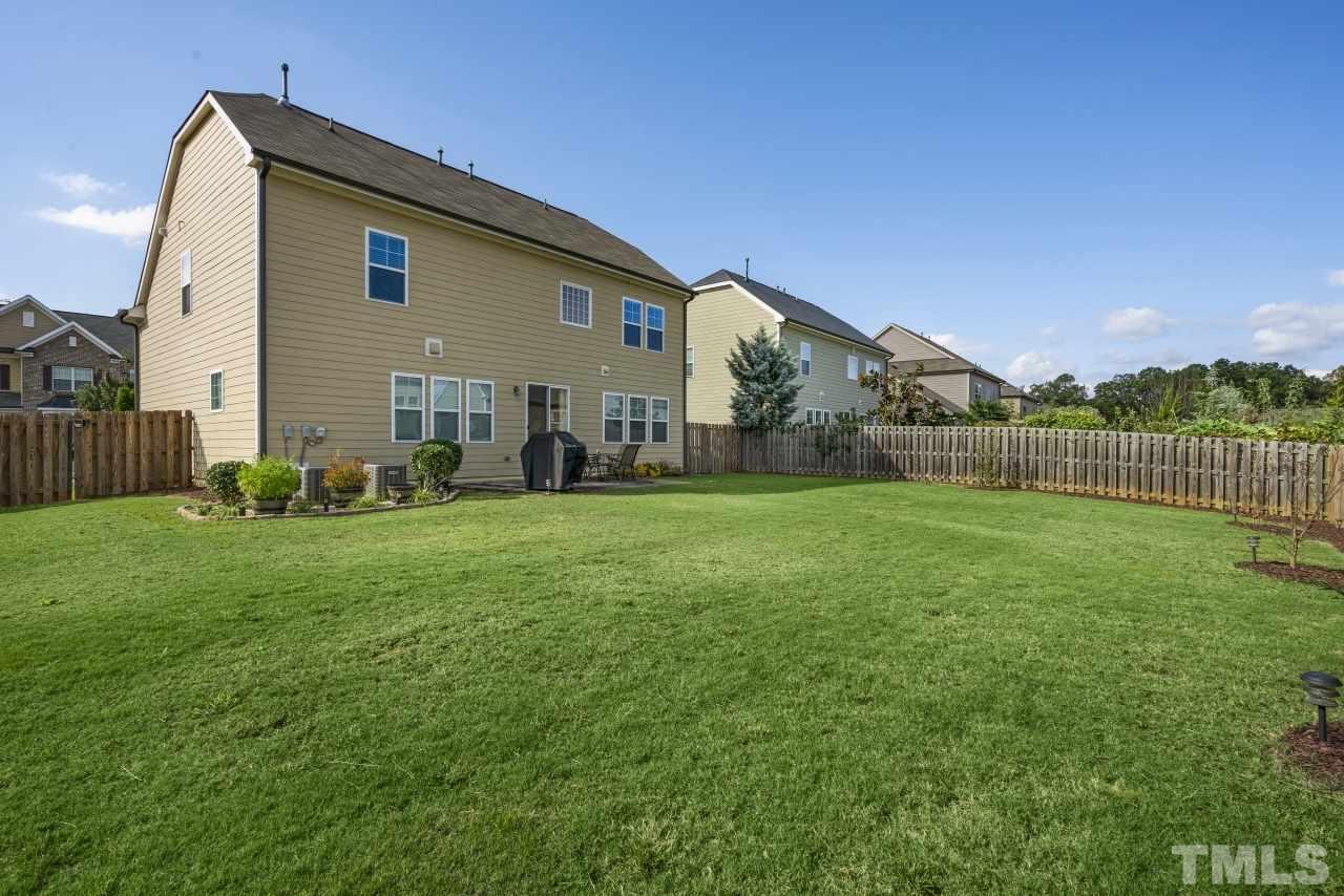 2433 Pilsley Road Apex, NC 27539 - Photo 25 of 28 a front view of house with yard and green space