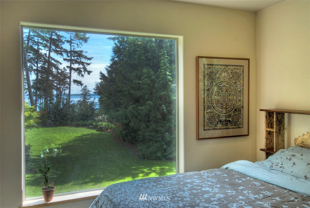 485 Whitecap Road Bellingham, WA 98229 - Photo 14 of 25 a bedroom with a bed and a painting on the wall