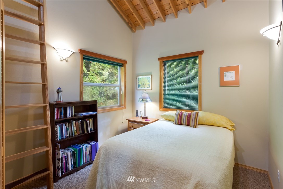 485 Whitecap Road Bellingham, WA 98229 - Photo 16 of 25 a bedroom with a bed and a book shelf