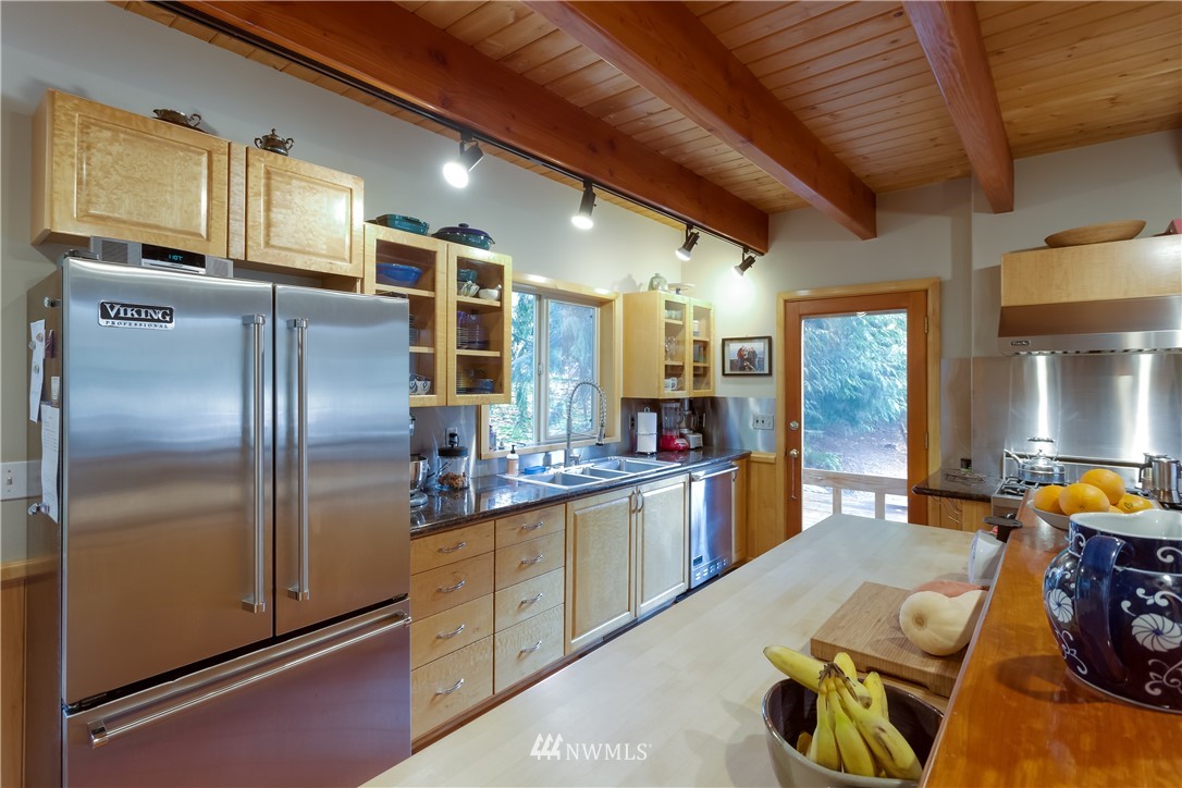 485 Whitecap Road Bellingham, WA 98229 - Photo 4 of 25 a kitchen with stainless steel appliances granite countertop a refrigerator a stove and a sink with couches
