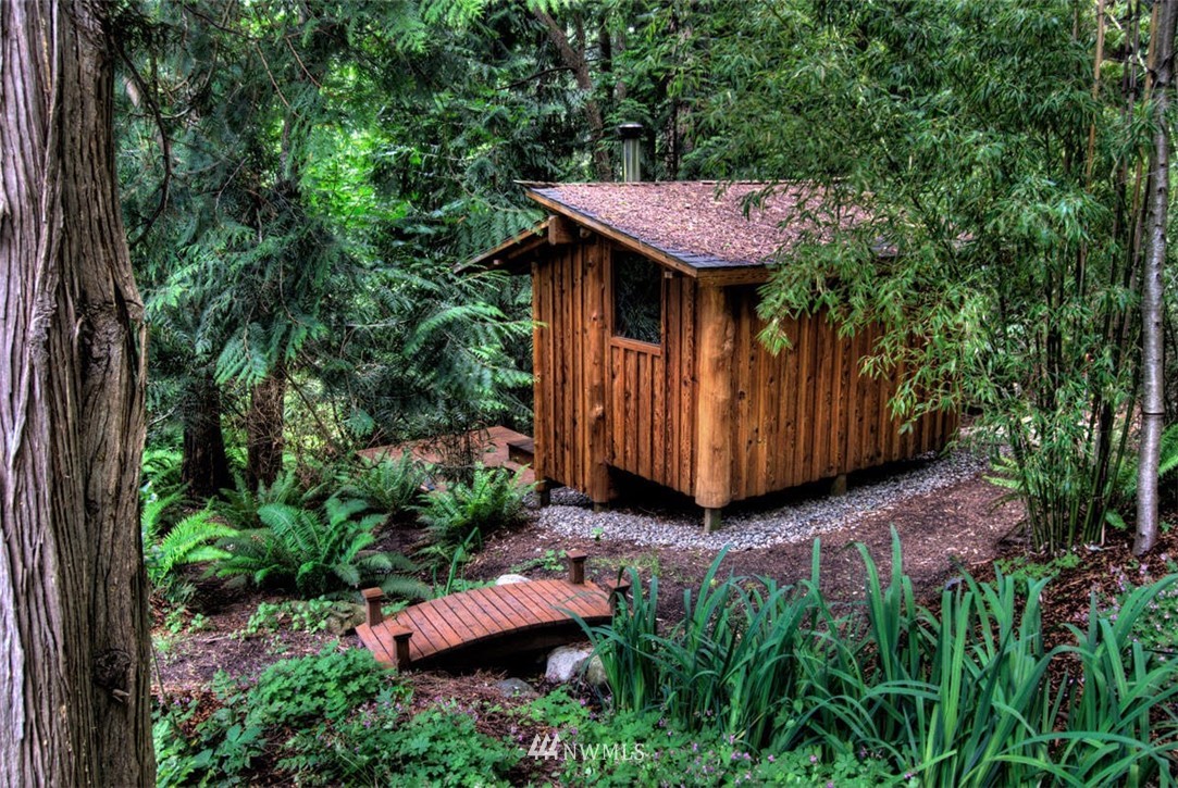 485 Whitecap Road Bellingham, WA 98229 - Photo 6 of 25 a view of a wooden chair with a small yard in front of it