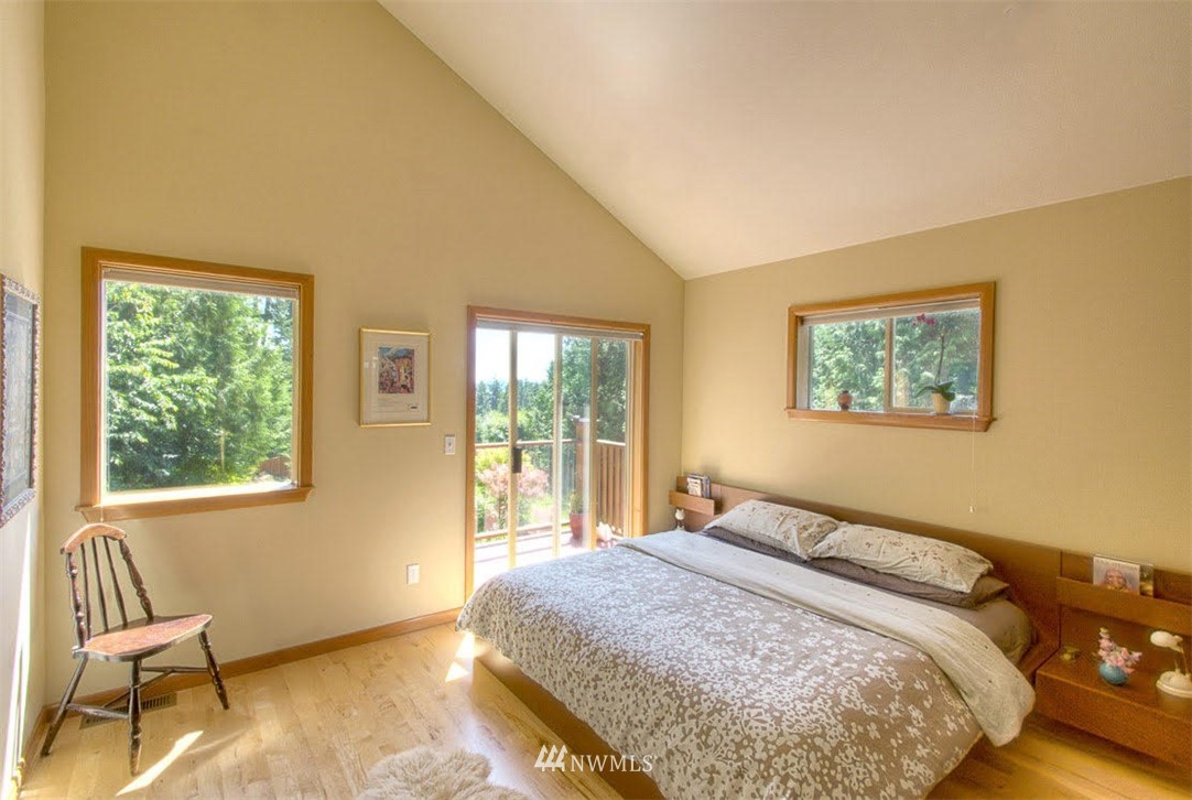 485 Whitecap Road Bellingham, WA 98229 - Photo 8 of 25 a bedroom with a bed and wooden floor
