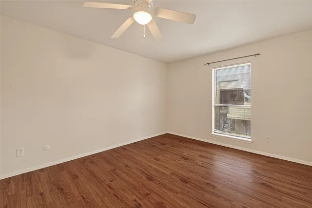 a kitchen with a sink a counter top space stainless steel appliances and cabinets