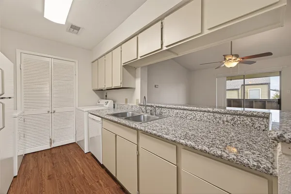 a view of kitchen with wooden floor
