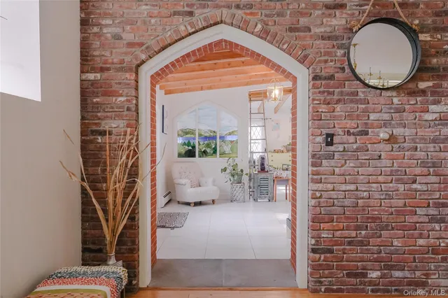 a bedroom with furniture and a chandelier