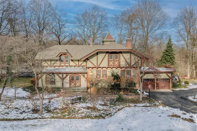 a view of a house with a snow in the yard