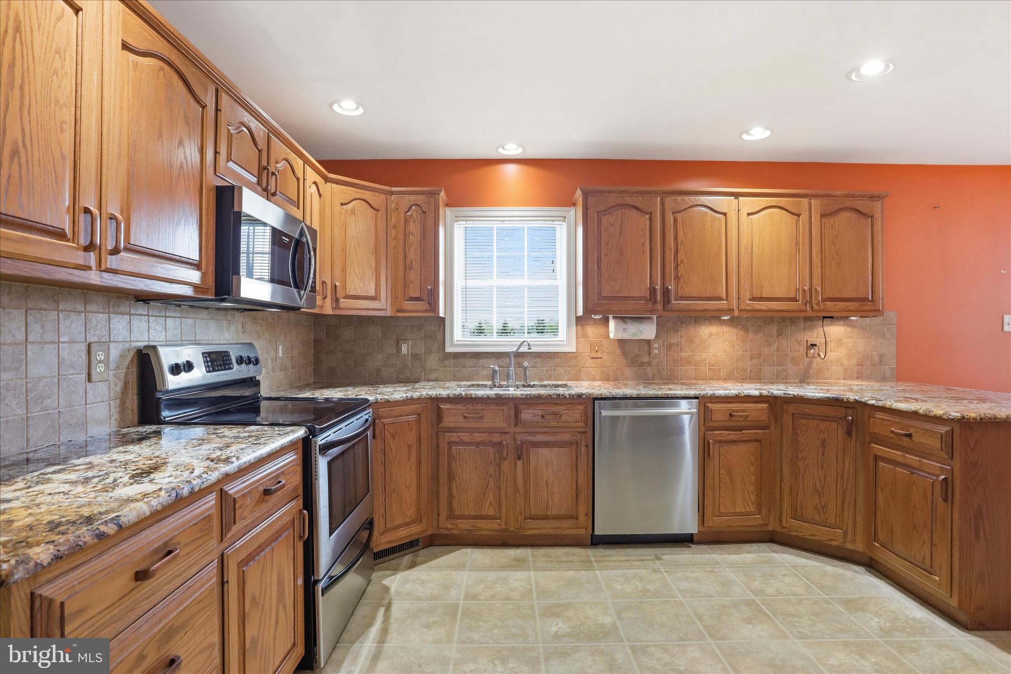2309 Hafer Road, Unit 1 Fayetteville, PA 17222 - Photo 12 of 47 a kitchen with stainless steel appliances granite countertop a sink stove and cabinets