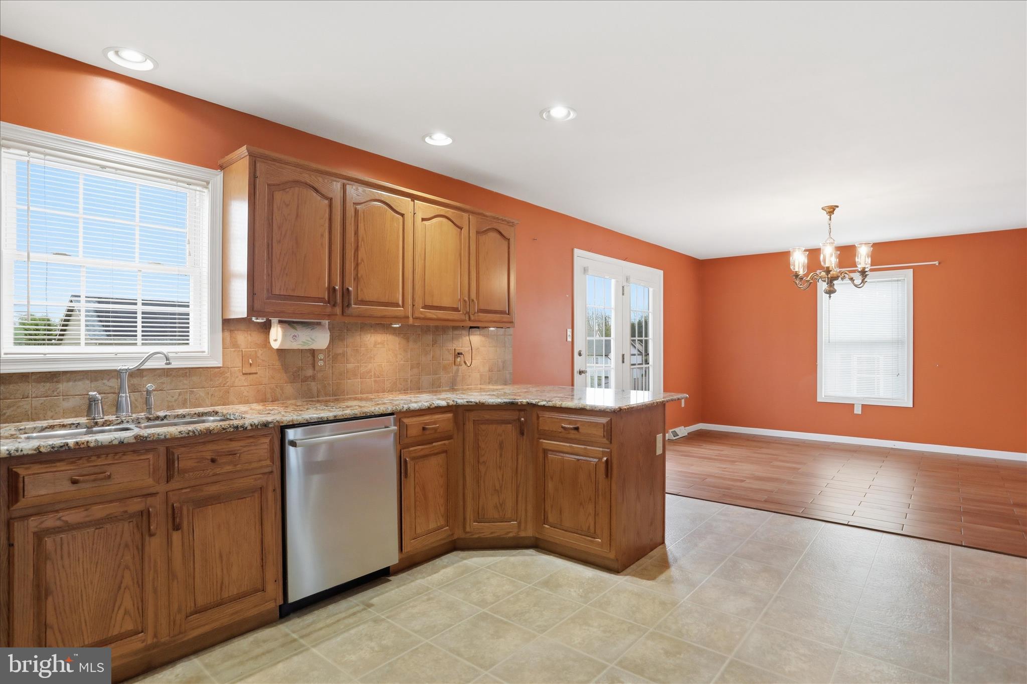 2309 Hafer Road, Unit 1 Fayetteville, PA 17222 - Photo 13 of 47 a large kitchen with granite countertop a sink and dishwasher cabinets with wooden floor