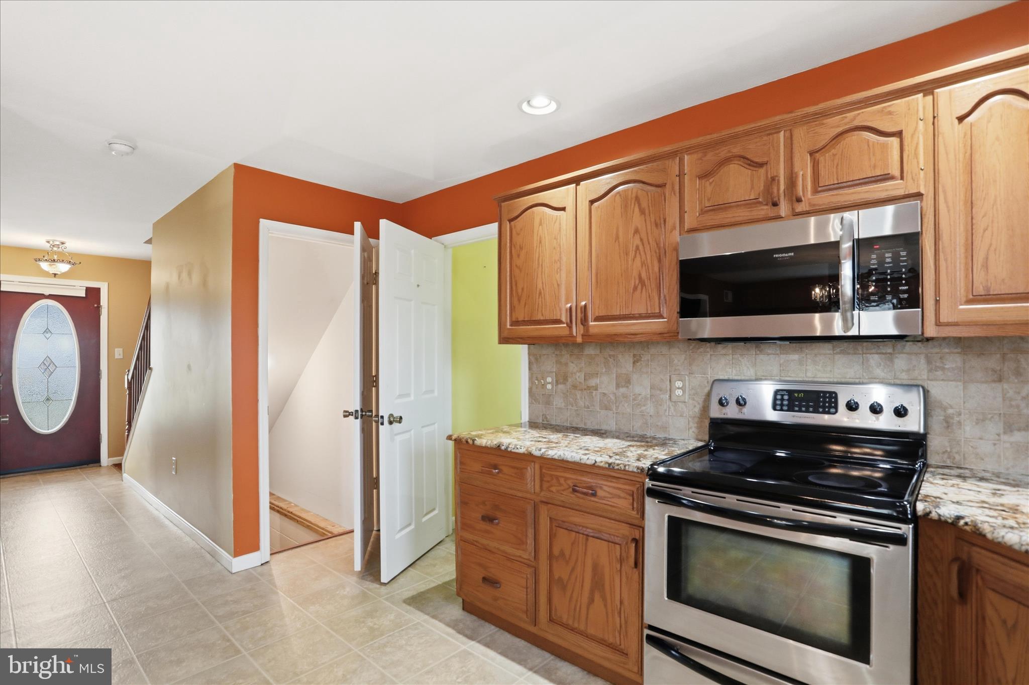2309 Hafer Road, Unit 1 Fayetteville, PA 17222 - Photo 15 of 47 a kitchen with stainless steel appliances granite countertop a stove top oven a sink and cabinets