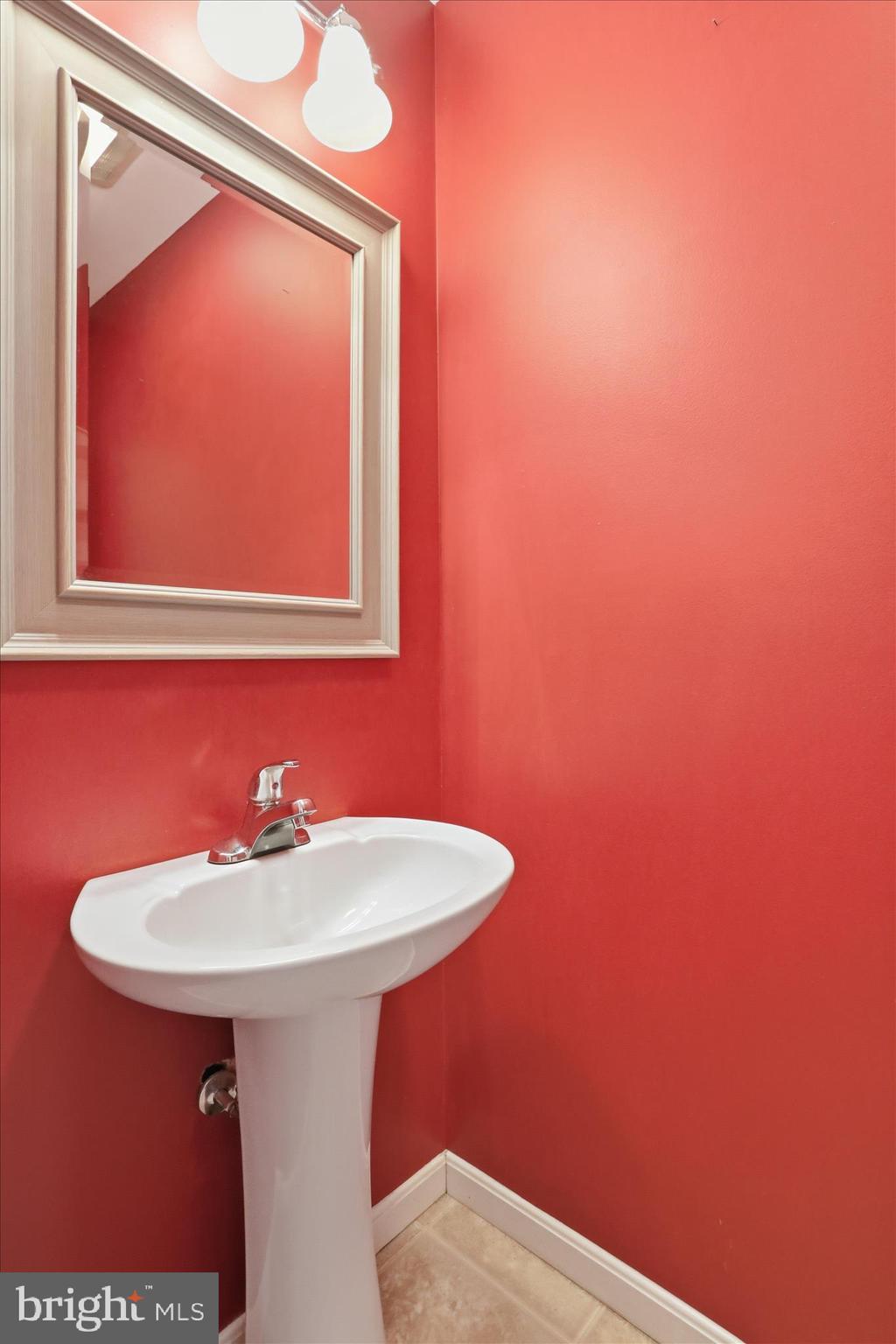 2309 Hafer Road, Unit 1 Fayetteville, PA 17222 - Photo 16 of 47 a bathroom with a sink a mirror and a gate