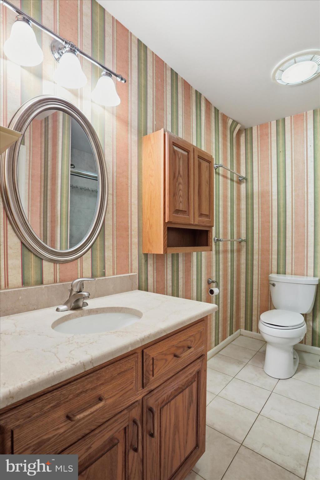 2309 Hafer Road, Unit 1 Fayetteville, PA 17222 - Photo 33 of 47 a bathroom with a sink a vanity and a mirror