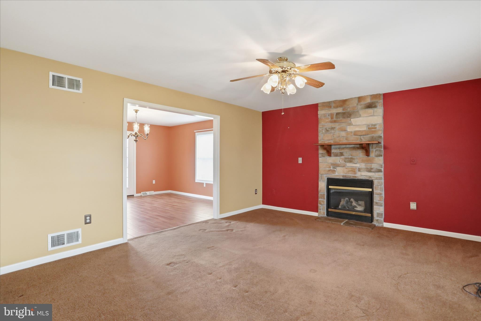 2309 Hafer Road, Unit 1 Fayetteville, PA 17222 - Photo 6 of 47 a view of a livingroom with a chandelier fan and a fireplace