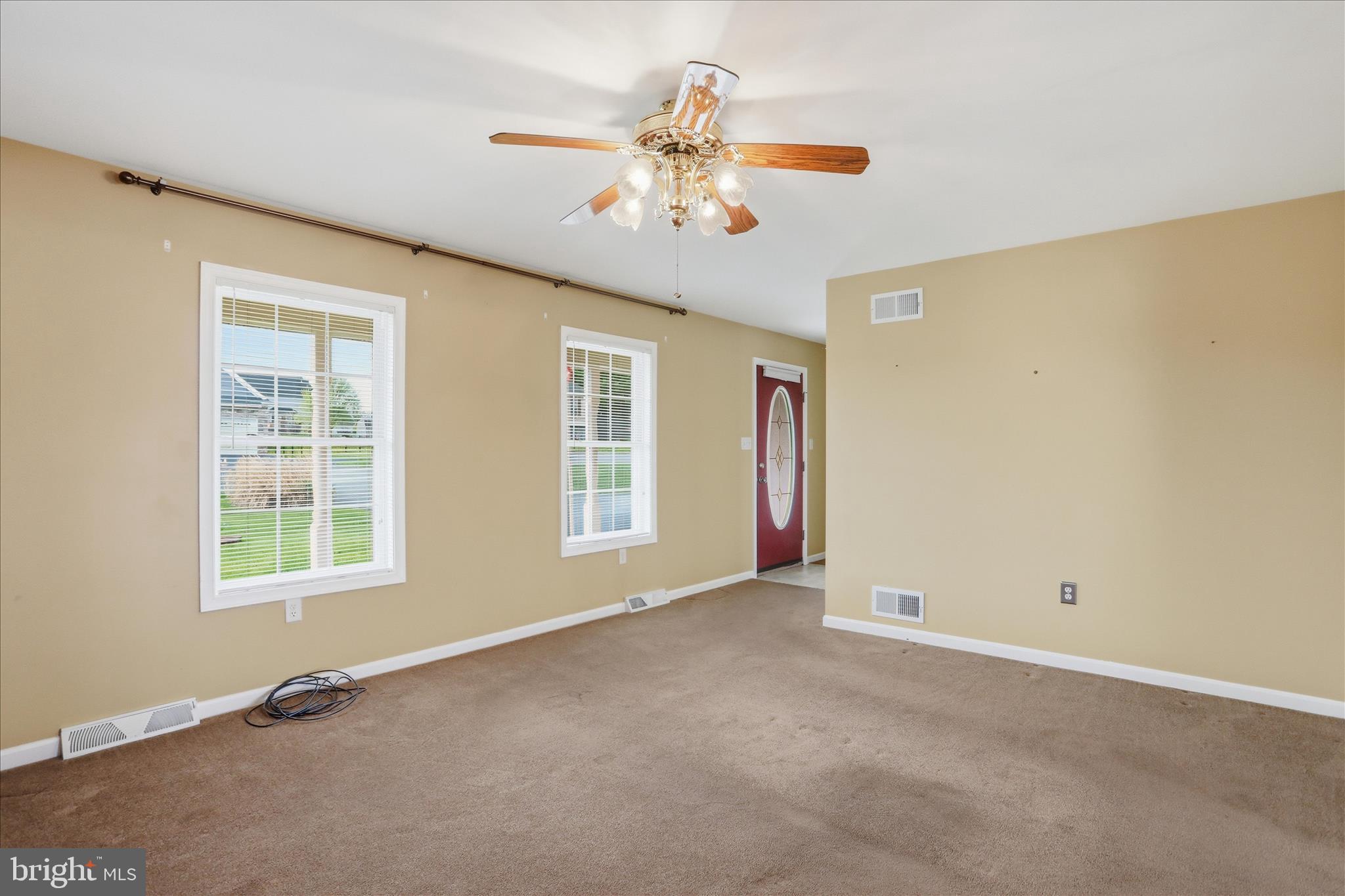 2309 Hafer Road, Unit 1 Fayetteville, PA 17222 - Photo 8 of 47 an empty room with chandelier fan and windows