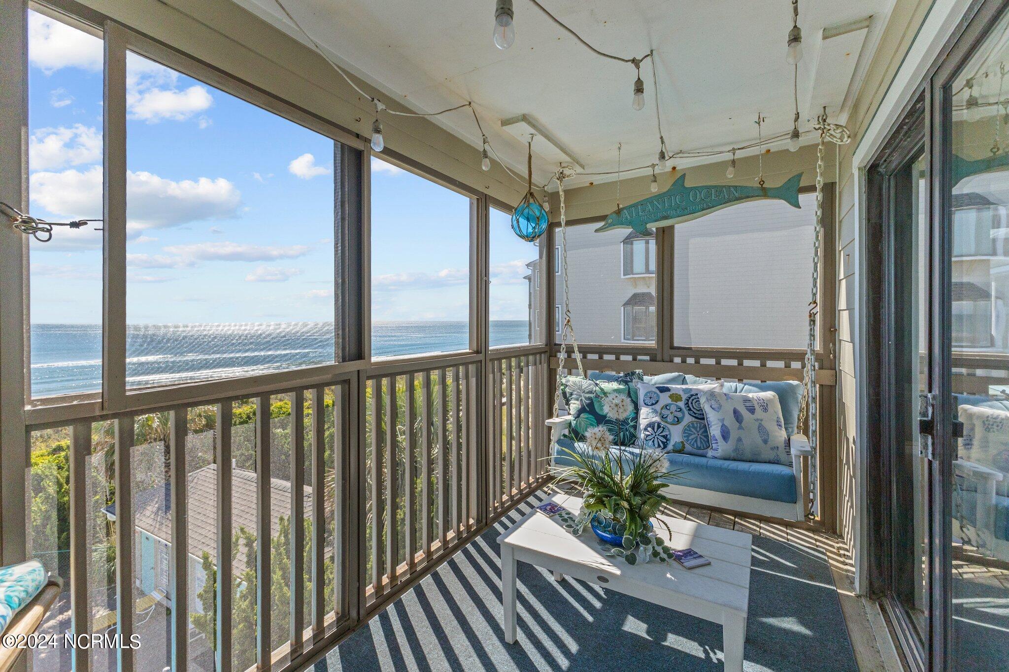 497 Salter Path Road, Unit B22 Pine Knoll Shores, NC 28512 - Photo 14 of 36 Screened in patio