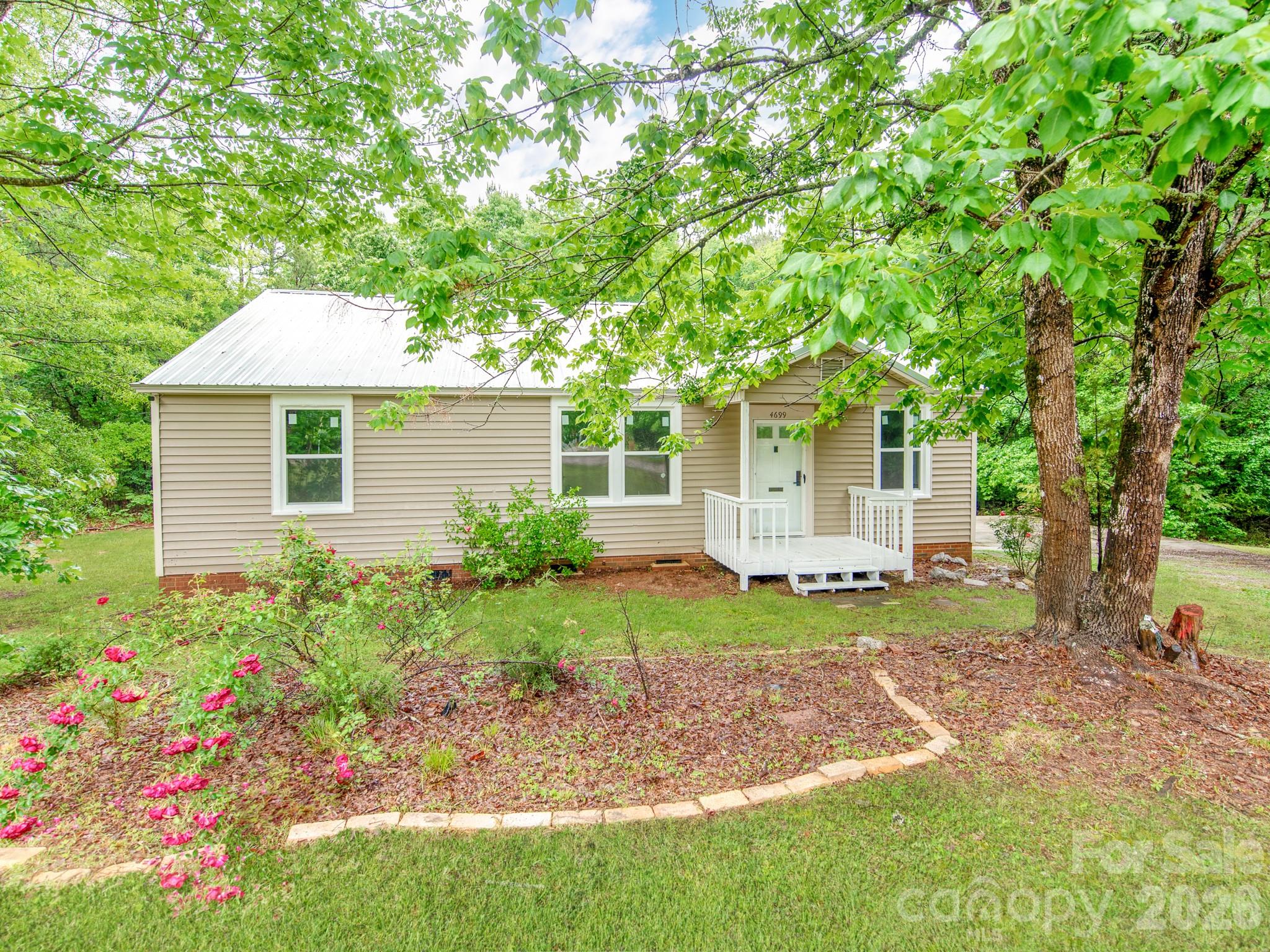 4699 Cherrystone Road Lancaster, SC 29720 - Photo 3 of 28 a front view of a house with garden