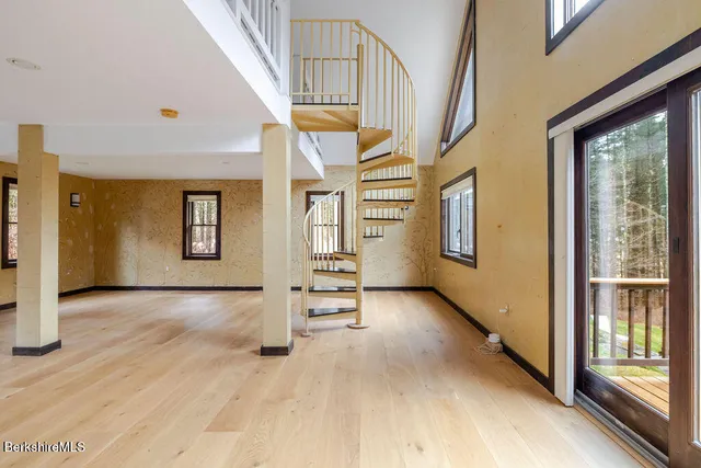 a view of washer and dryer with kitchen in the background
