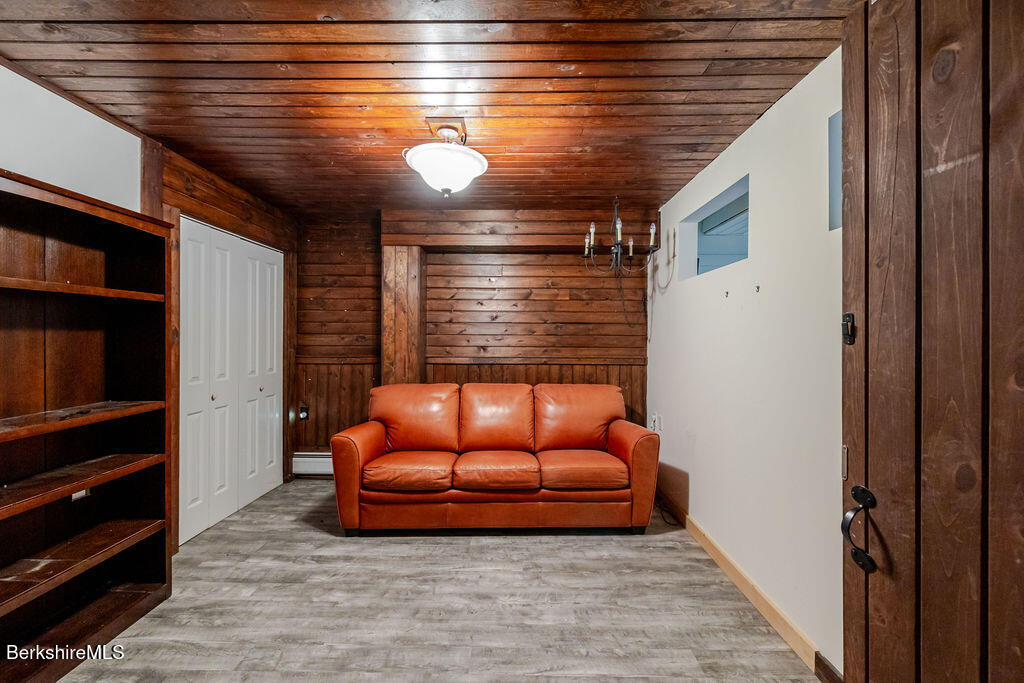 9 Bott Hill Road Egremont, MA 01230 - Photo 43 of 47 a blue room with wooden floor and furniture