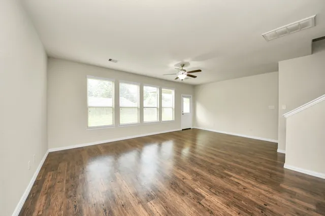 a view of a kitchen with a sink and a stove top oven