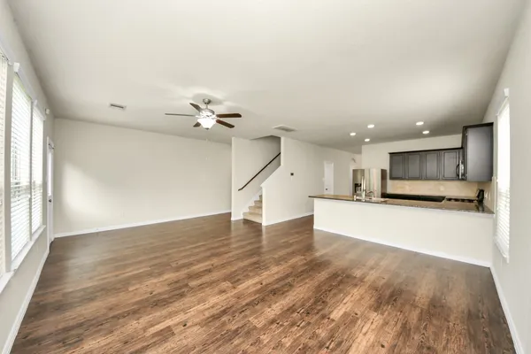 a view of a kitchen with a sink and a window