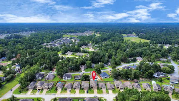 a view of a room with wooden floor and staircase