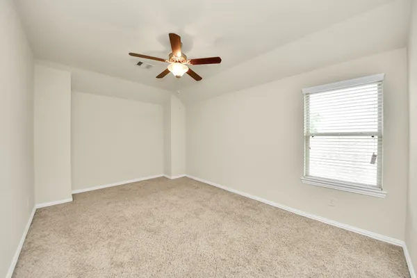 a view of a big room with carpet