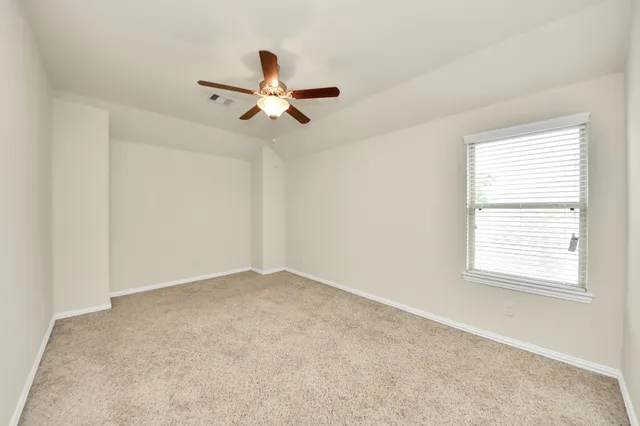 a view of a big room with carpet