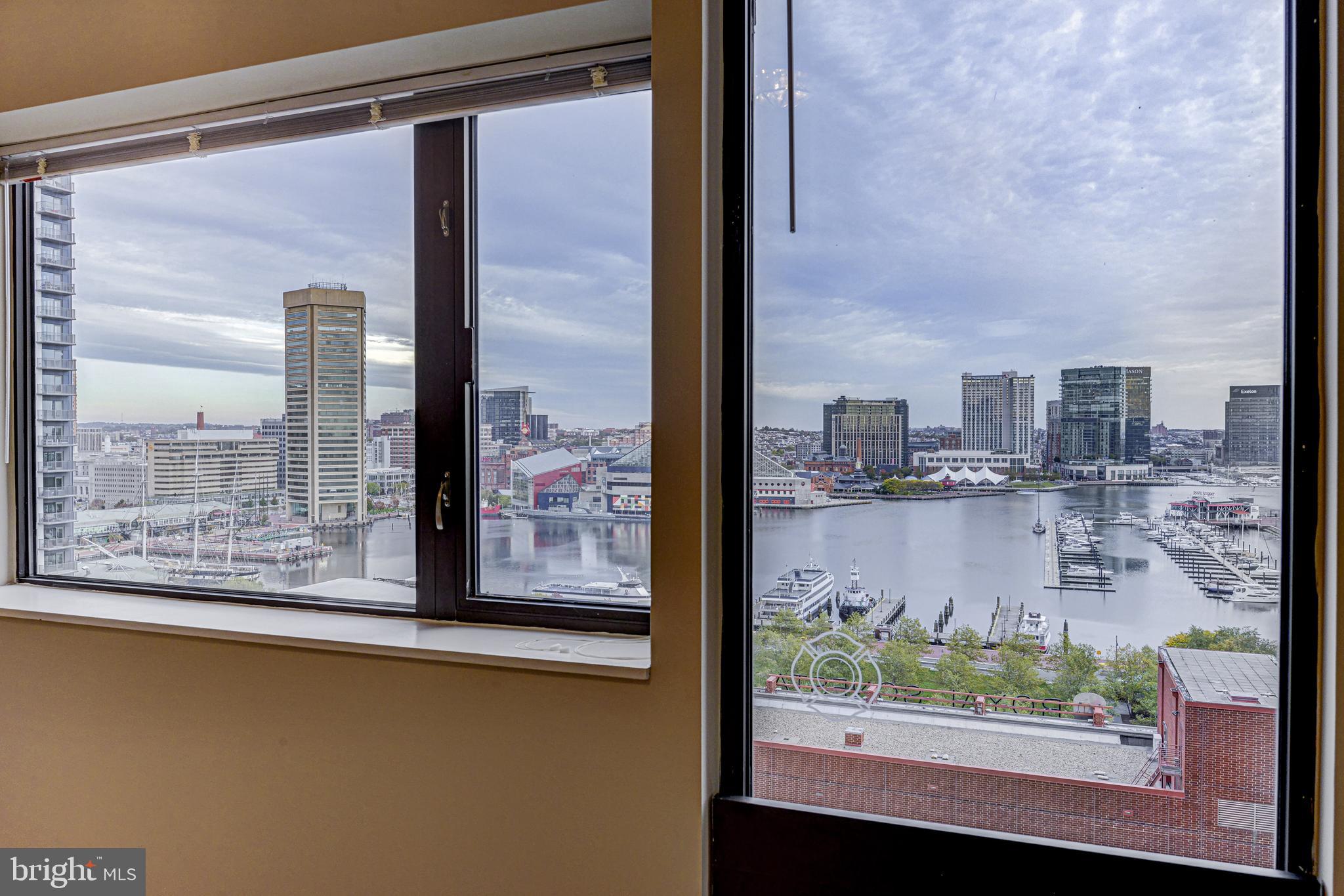 10 East Lee Street, Unit 1208 Baltimore, MD 21202 - Photo 23 of 43 Bedroom with incredible view of the Inner Harbor