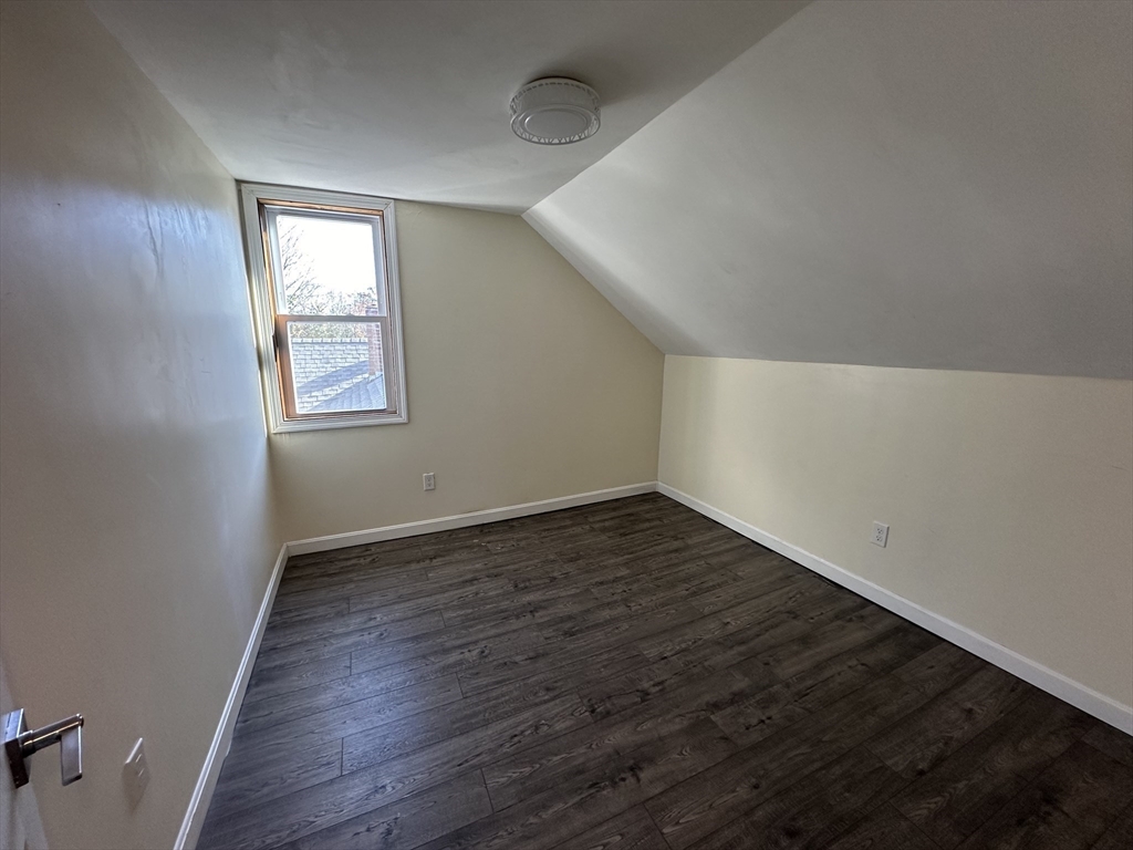 8 Pike Street Hopkinton, MA 01748 - Photo 31 of 34 an empty room with wooden floor and windows