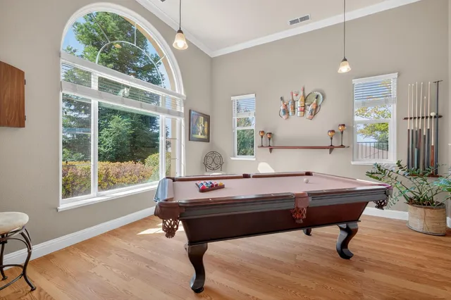 a large kitchen with a table and chairs