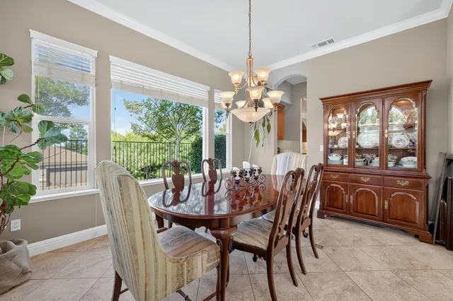 a living room with furniture and view of kitchen