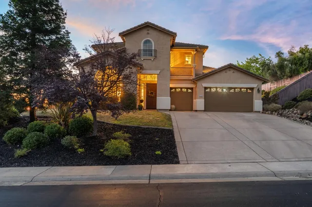 a view of a house with a tub and a garden