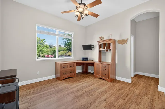 a view of a chairs and table in the patio