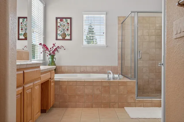 an aerial view of a house with yard and outdoor seating