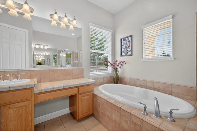 a view of swimming pool with outdoor seating and plants