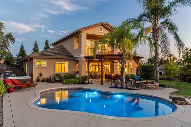 a room with pool table and windows