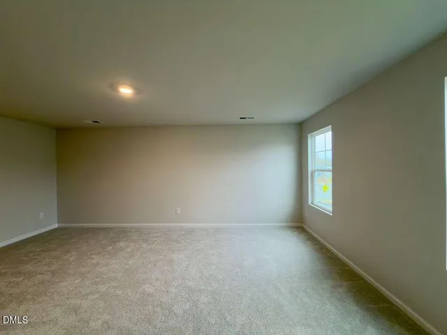 a bathroom with a double vanity sink mirror and shower