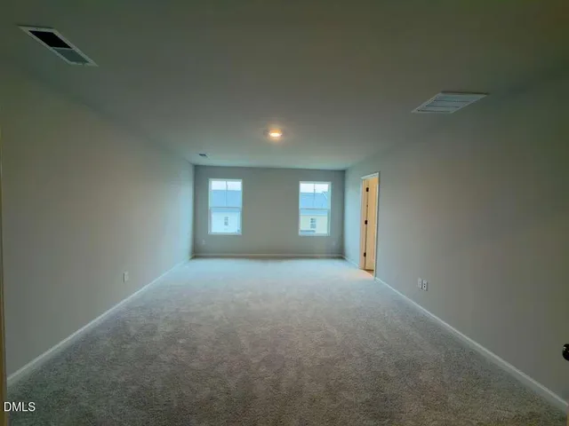 a bathroom with a shower sink and mirror