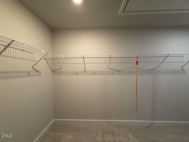 a bathroom with a sink a toilet a mirror and bathtub