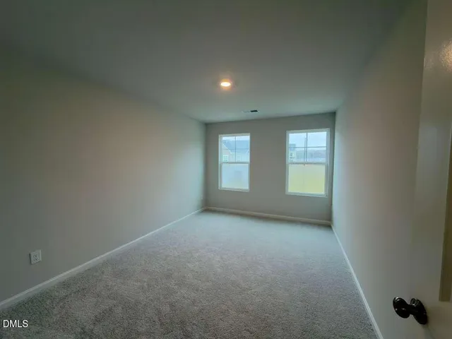 a view of swimming pool with seating space