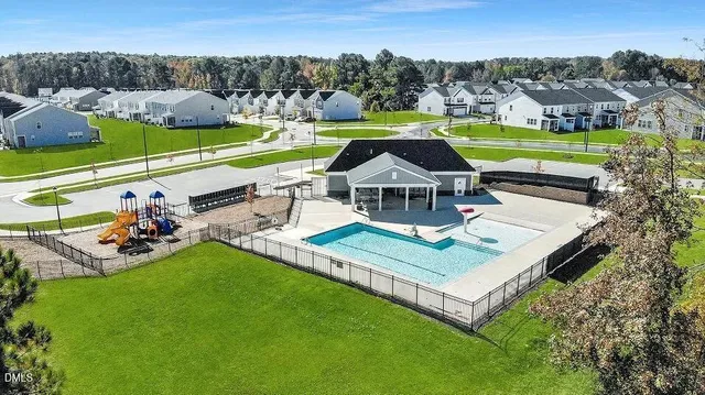 a view of a swimming pool with an outdoor seating